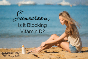 girl putting on sunscreen by the beach: text: sunscreen, is it blocking vitamin D?