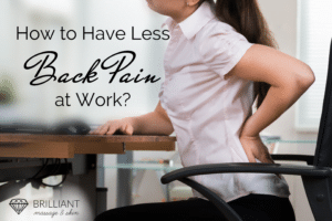 an office worker having a back pain while sitting on her office chair: text: how to have less back pain at work?