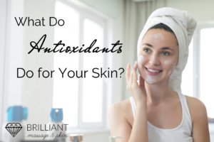 girl just finished taking a shower with towel on her head putting some skincare products on her face: text: what do antioxidants do for your skin?
