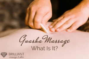 two hands using a tool to a clients back for massage; text: guasha massage what is it?