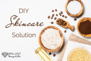 body scrub in a bowl, oil, coffee beans, salts, ground coffee; text; DIY skincare solution