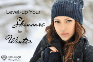 girl in black jacket and bonnet outside in snow: text: level-up your skincare for winter