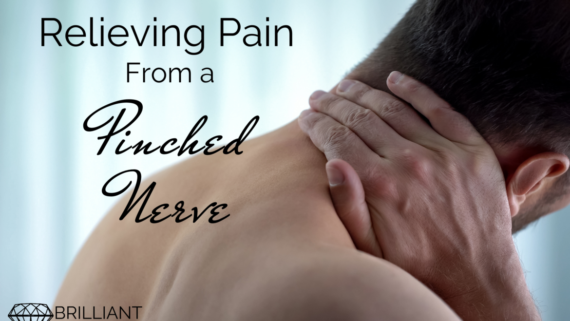 guy holding his neck: text: relieving pain from a pinched nerve